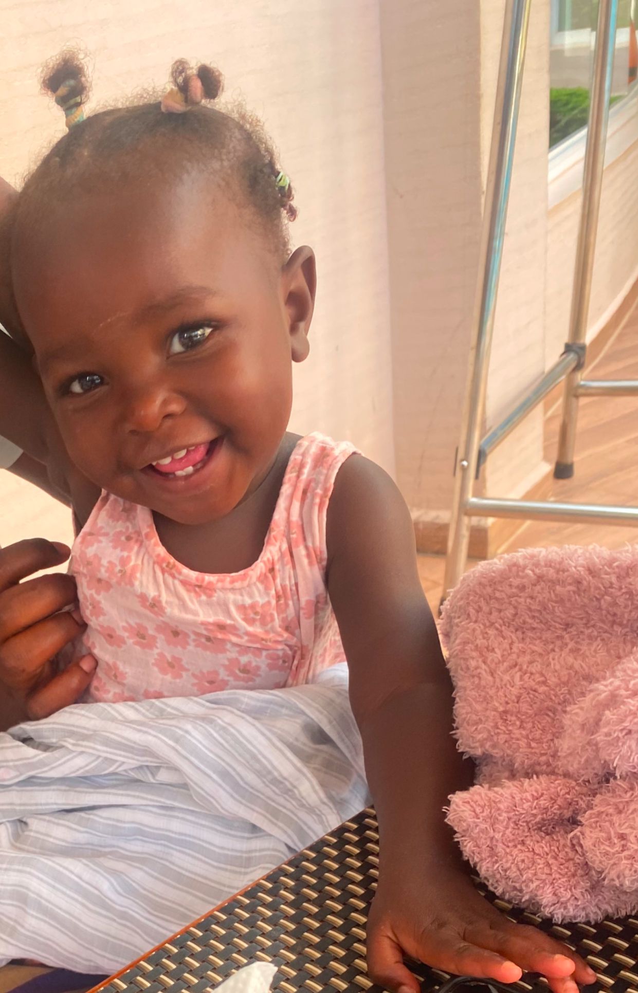 A smiling child at Hope Caring CBO